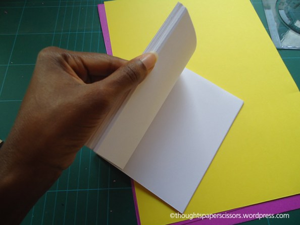 Flipping through pages to ensure glued side is secure