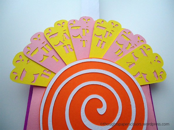 Close up of the full fan. Happy Birthday message in yellow and pink lettering