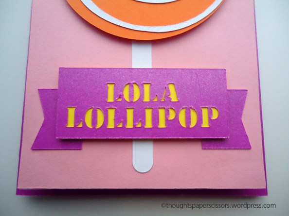 Close up of purple banner with cut out letters with yellow backing